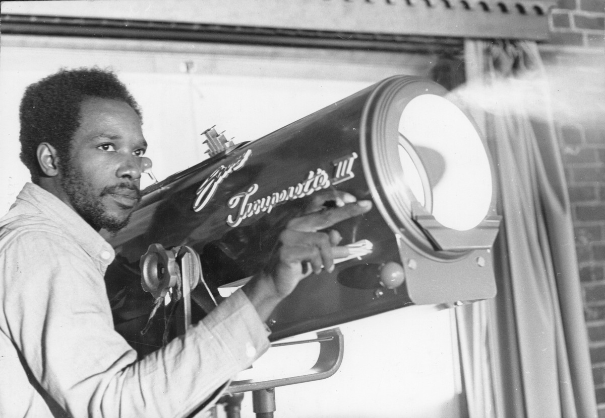 A student of the Massachusetts Correctional Institution at Norfolk (MCI-Norfolk) Prison Theatre program operates a spotlight, 1972. Image courtesy of Northeastern University Archives & Special Collections.