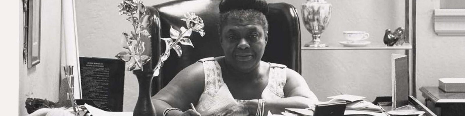 Black and white photo of Ms. Elma Lewis at desk